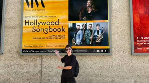 Maddy Harrison in front of a Hollywood Songbook billboard
